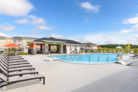 our apartments offer a swimming pool with lounge chairs and umbrellas