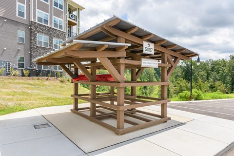 A wooden structure with a sign that reads