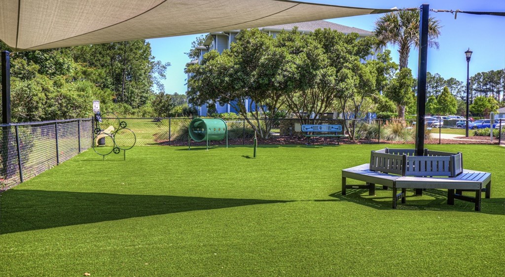 A park with a bench and a playground.