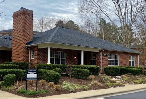 A brick clubhouse at Amelia Village apartments in Clayton, NC.