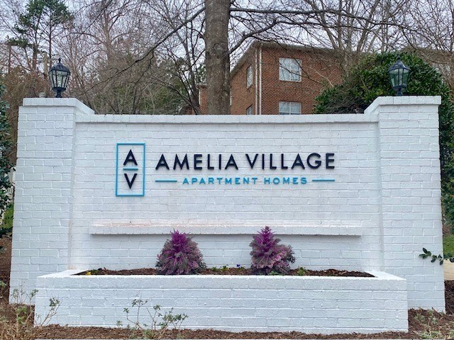 a white sign apartments homes