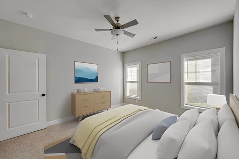 A bedroom with a bed, dresser, and ceiling fan.