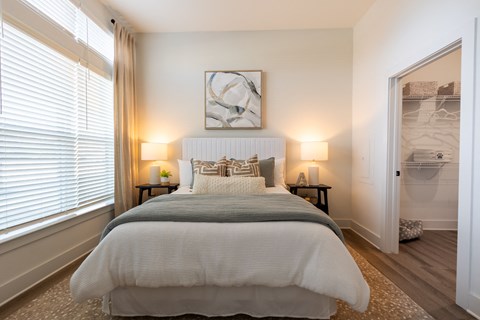 Altitude Raleigh Apartment Bedroom with a large walk-in closet and large window
