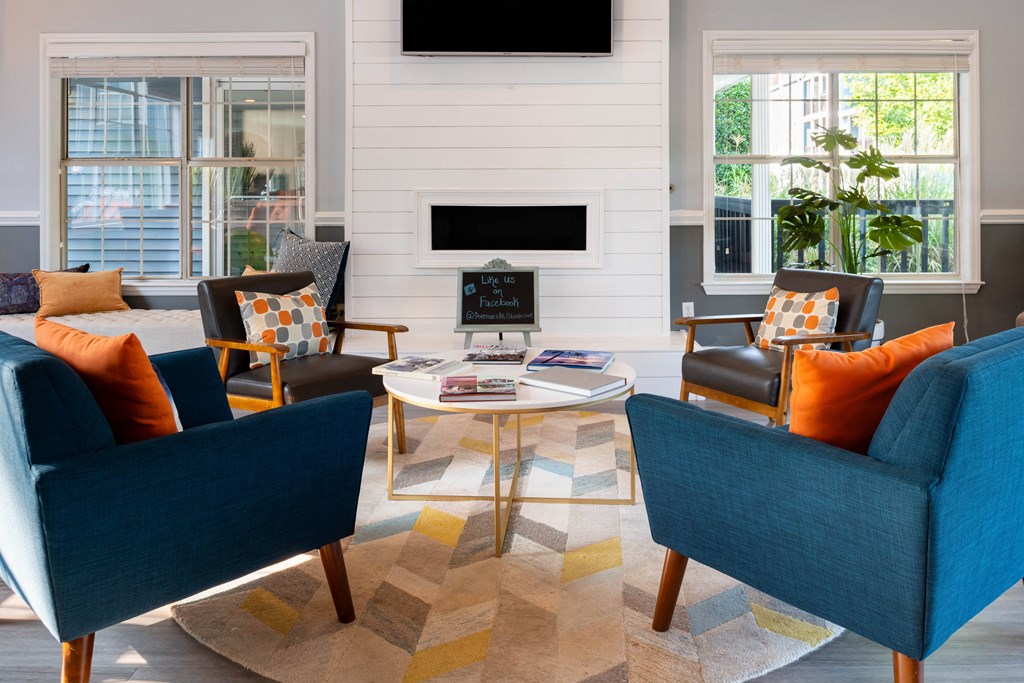 a living room filled with furniture and a flat screen tv