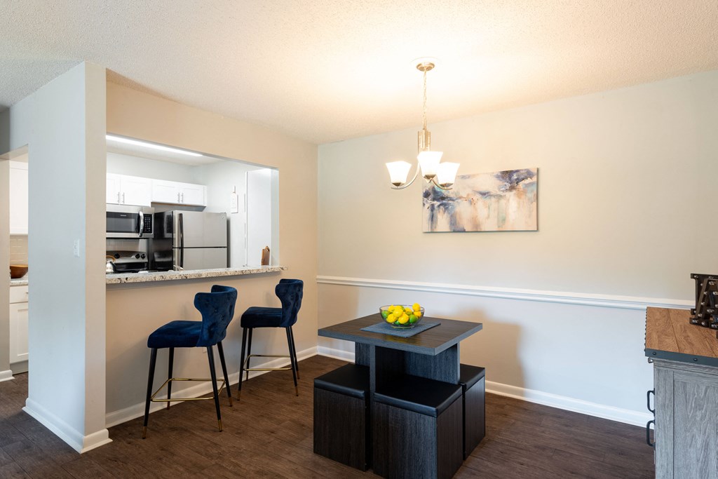 a kitchen and dining area in a 555 waverly unit