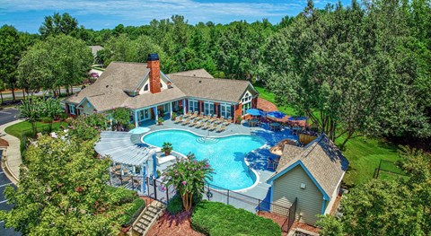 A large house with a pool in the backyard.