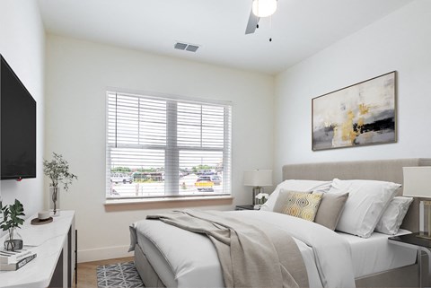 a bedroom with a large bed and a window