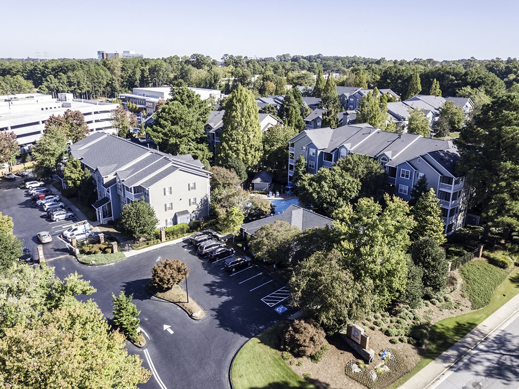 an aerial view of a neighborhood with houses and trees