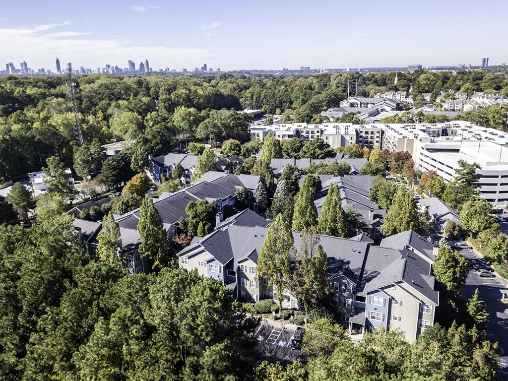 an aerial view of a neighborhood with houses and trees