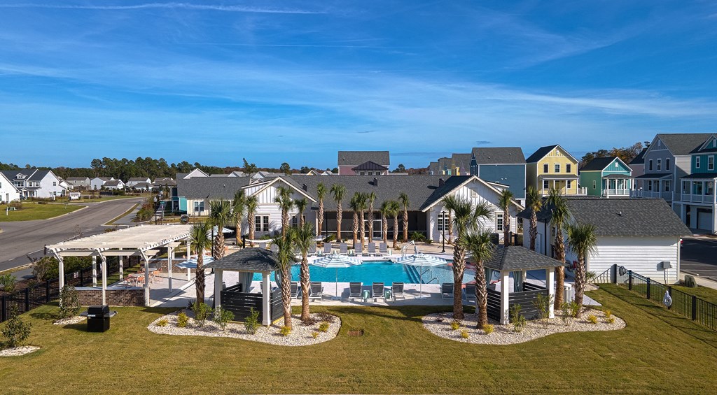 A large house with a pool in the backyard.