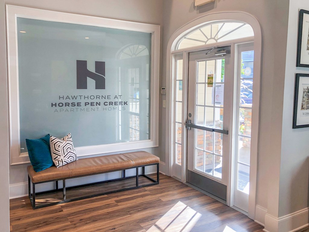 the entrance to the horse pen apartment building