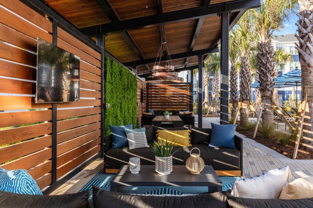 a patio with couches and a table