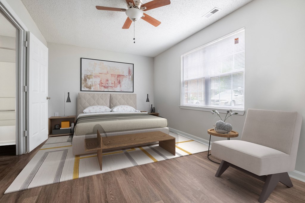 a bedroom with a bed and a ceiling fan