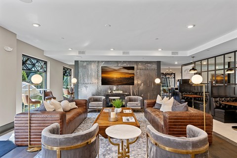 A modern living room with a large sectional sofa and a coffee table.