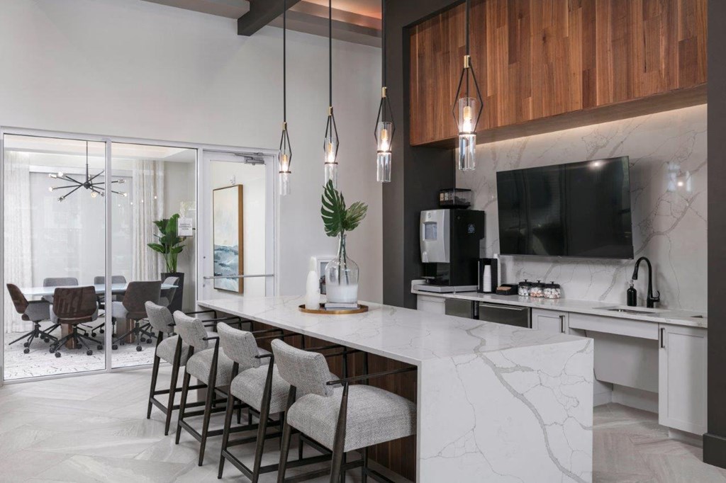 a kitchen and dining room with a marble counter top