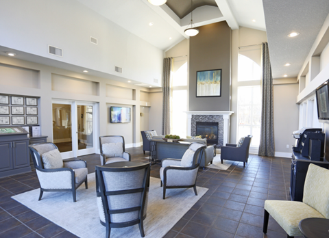 a dining room with a table and chairs and a fireplace