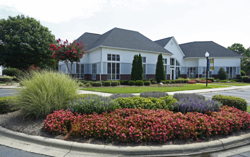 a house with a garden in front of it