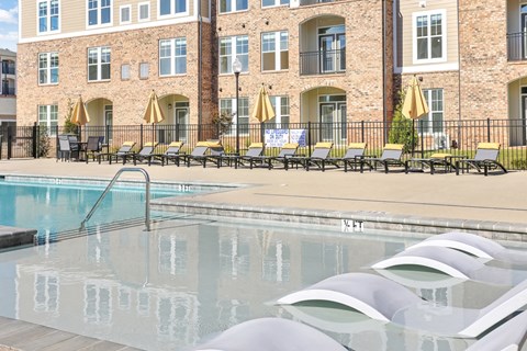 our apartments have a large pool and lounge chairs