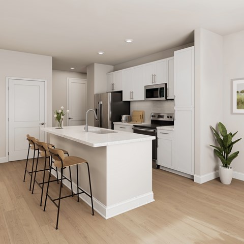 A modern kitchen with a white island and bar stools.
