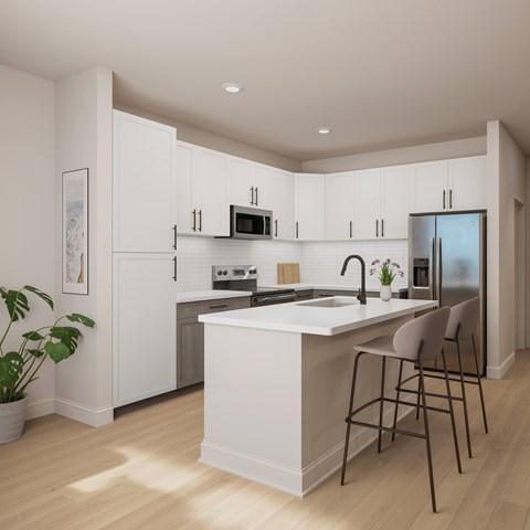A modern kitchen with white cabinets and a large island.