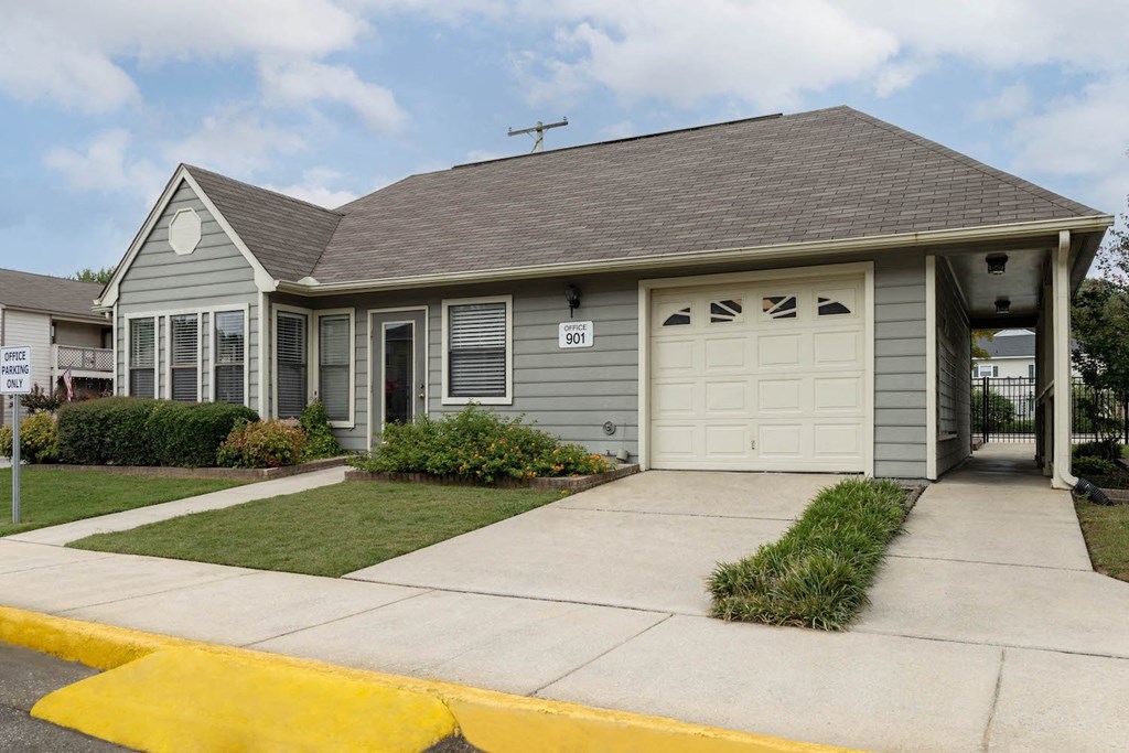 a gray house with a white garage door