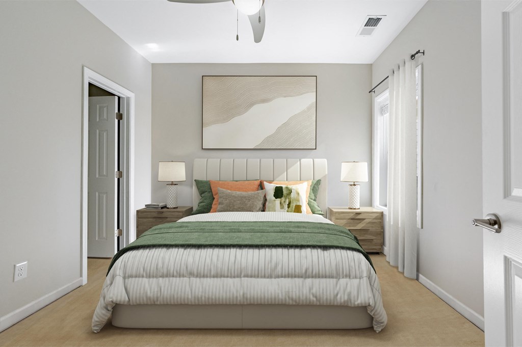 a bedroom with a bed and a painting on the wall