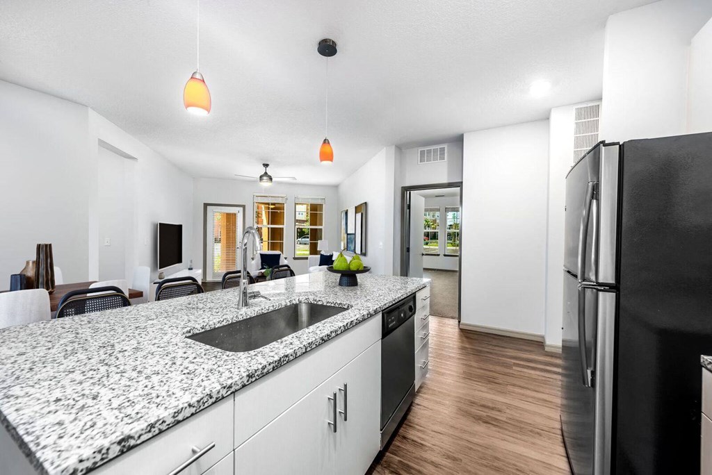 a kitchen with a counter top and a refrigerator