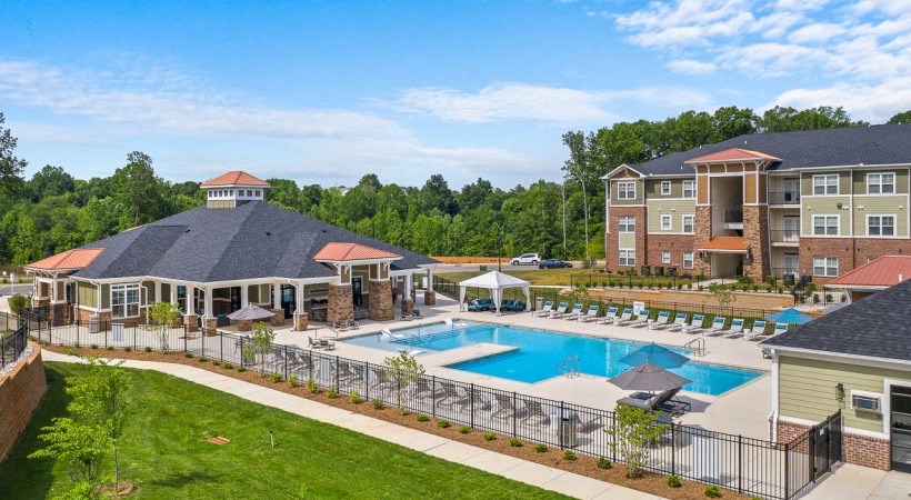 pool area with chairs and umbrellas