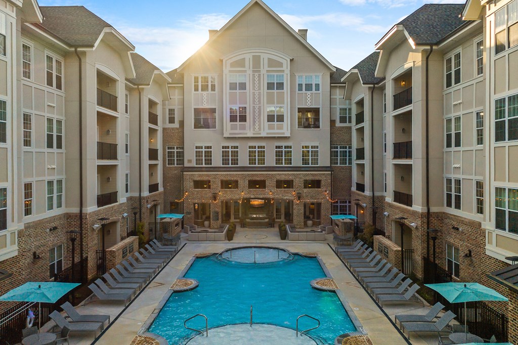 a large swimming pool in the middle of an apartment building