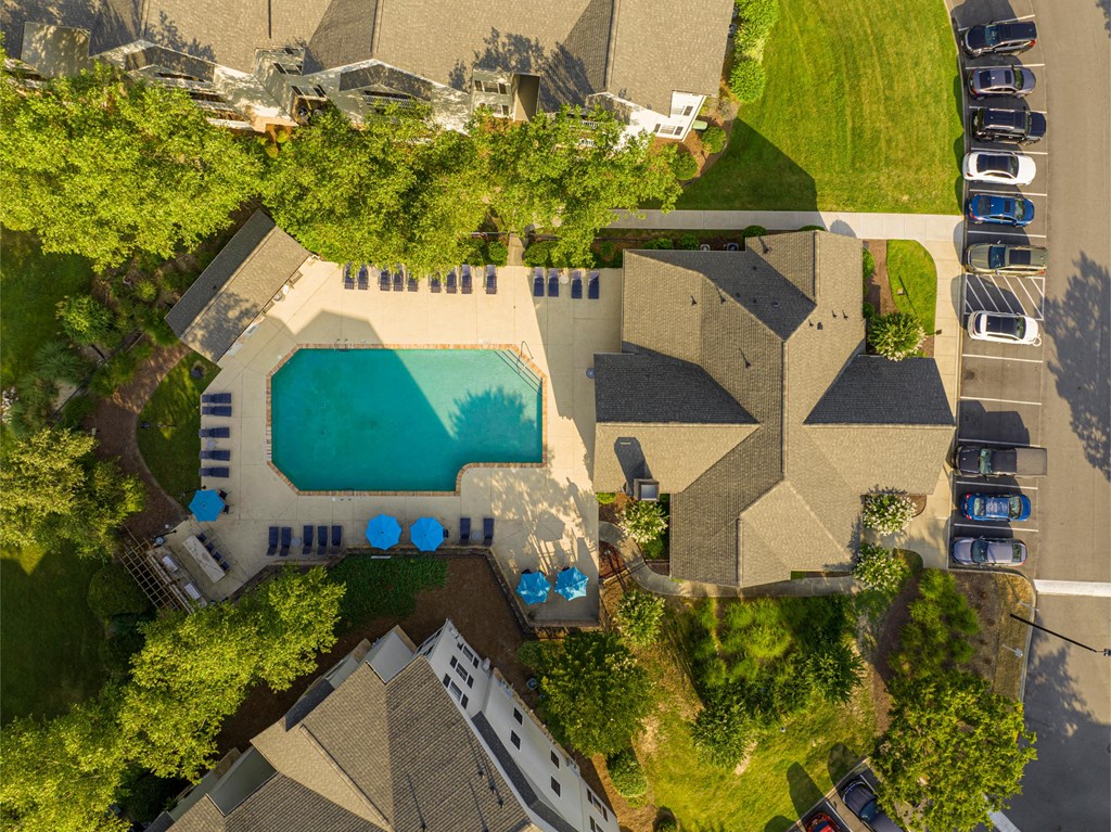 a birds eye view of a house with a swimming pool