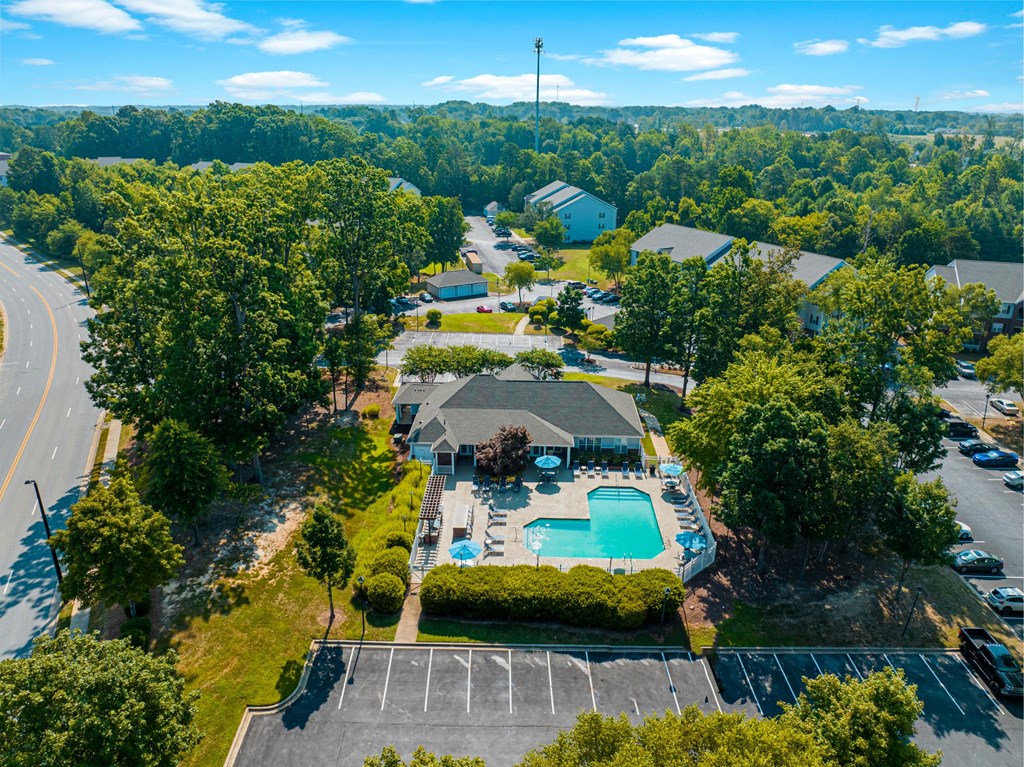 a birds eye view of the resort style pool and spa at the crossings apartments