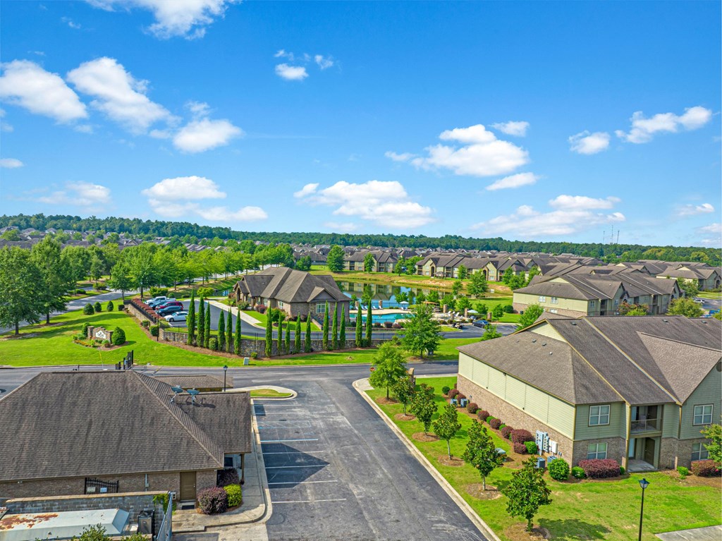 an aerial view of a neighborhood with houses and a pool