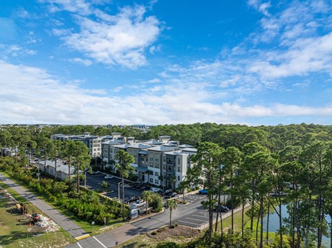 an aerial view of a city with trees and buildings