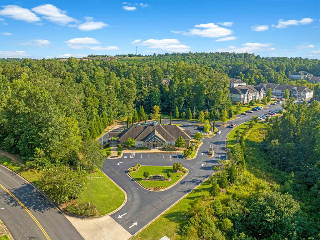 a view from above of a neighborhood with houses and trees