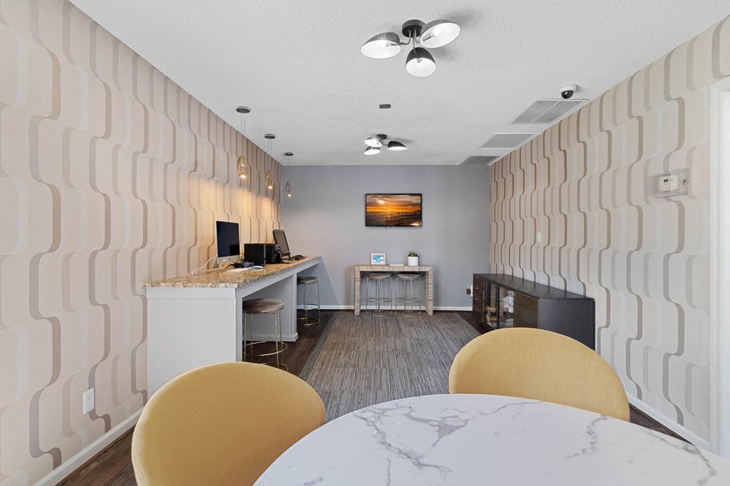 a dining room with a table and chairs