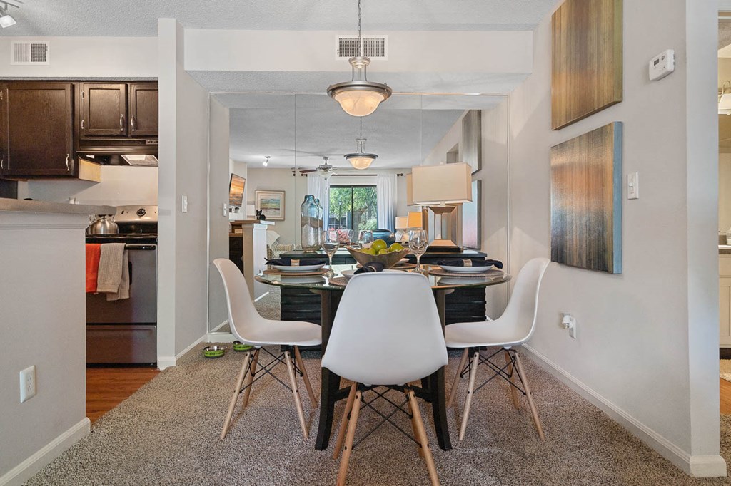 a dining room with a table and chairs