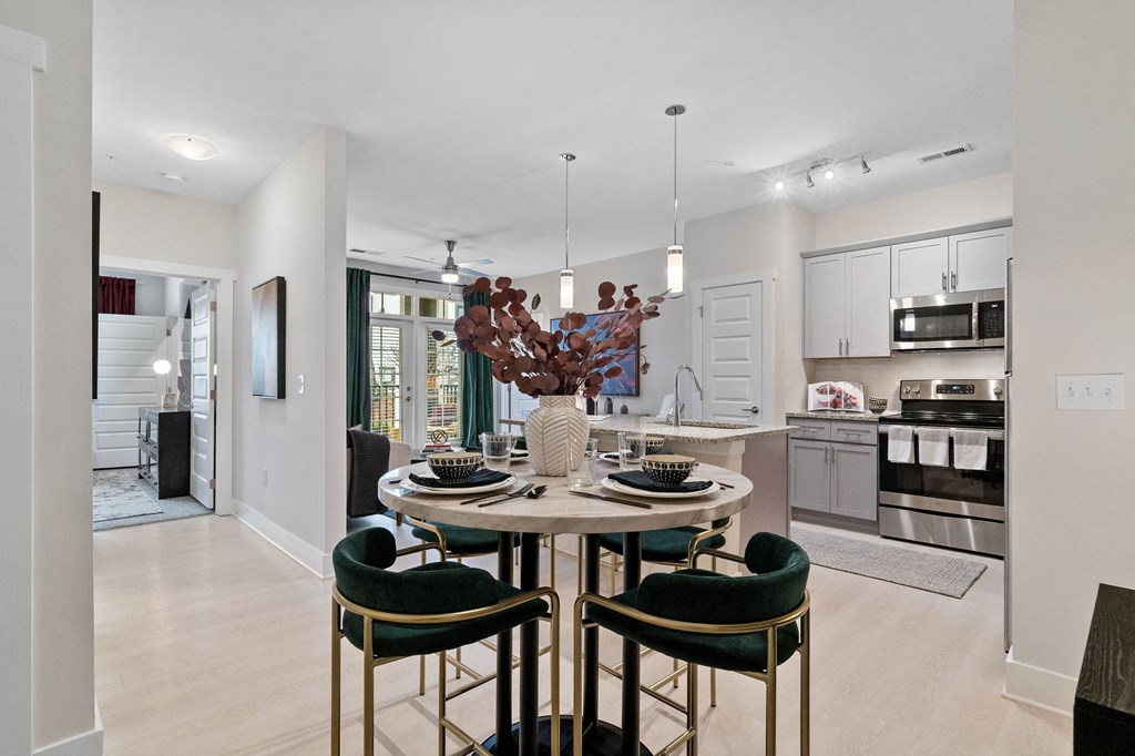 an open kitchen and dining room with a table and chairs