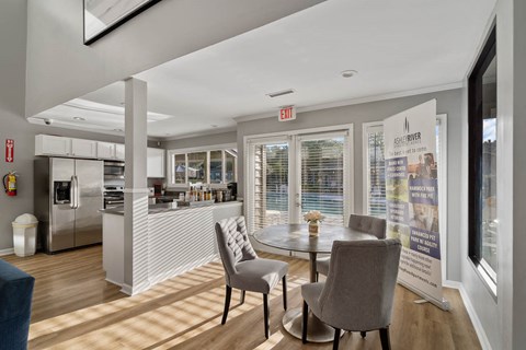 a kitchen and dining room with a table and chairs