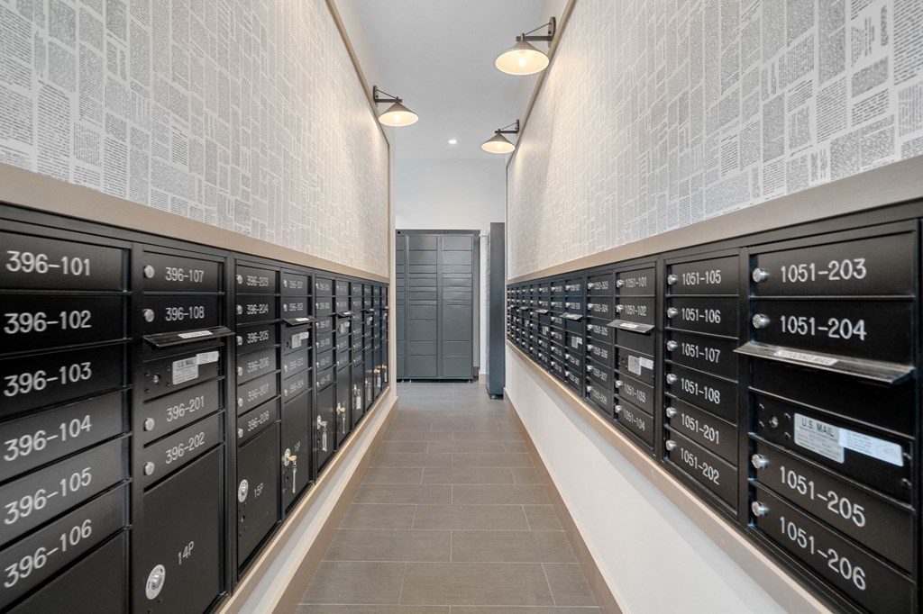 a long hallway with many filing cabinets in a room with a door