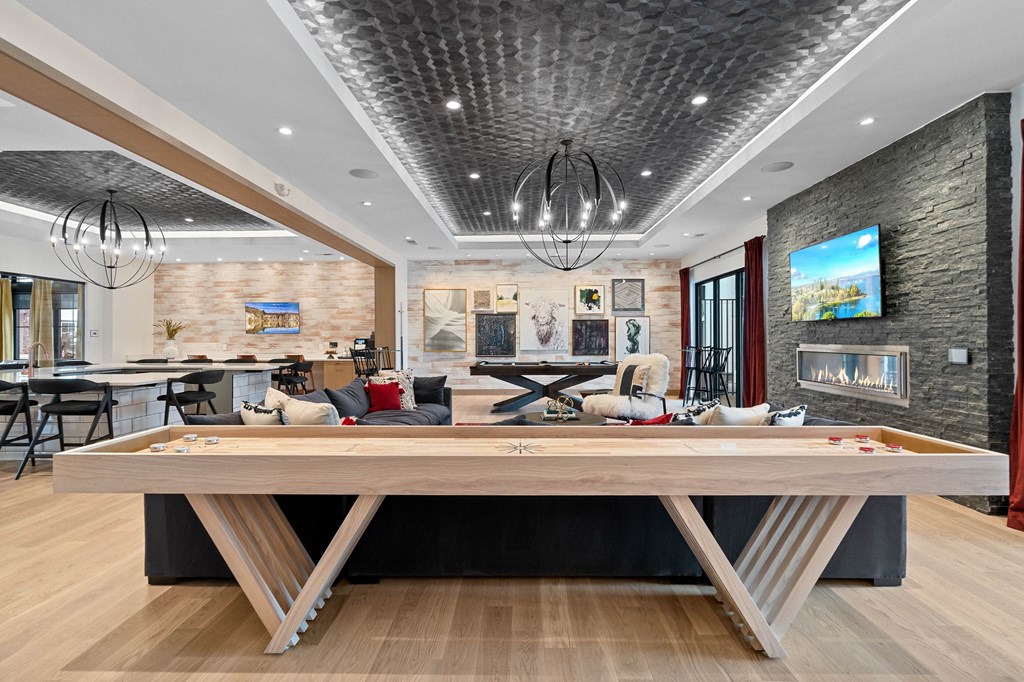 a game room with a pool table and a bar