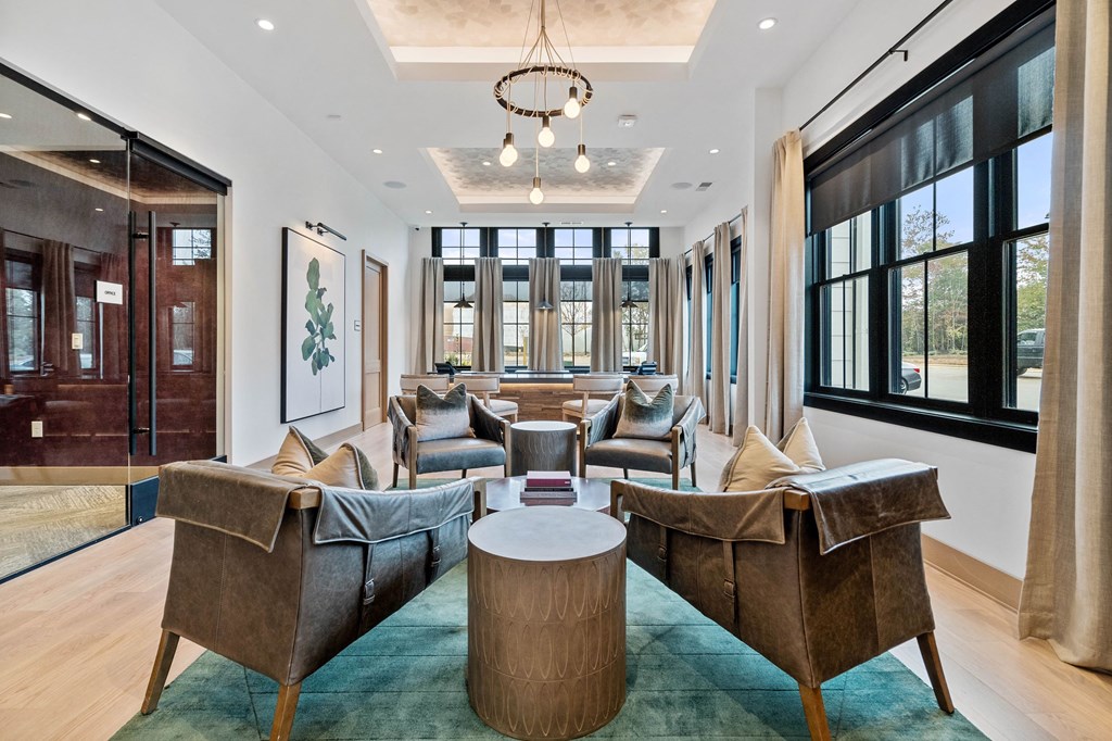 a living room with couches and chairs and a table