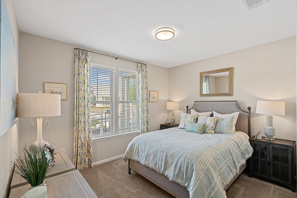 a bedroom with a large bed and a window