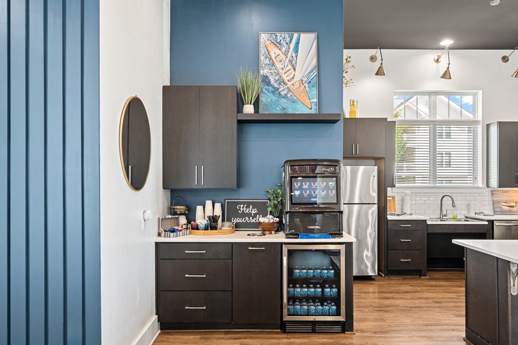 a kitchen with blue walls and a stainless steel refrigerator