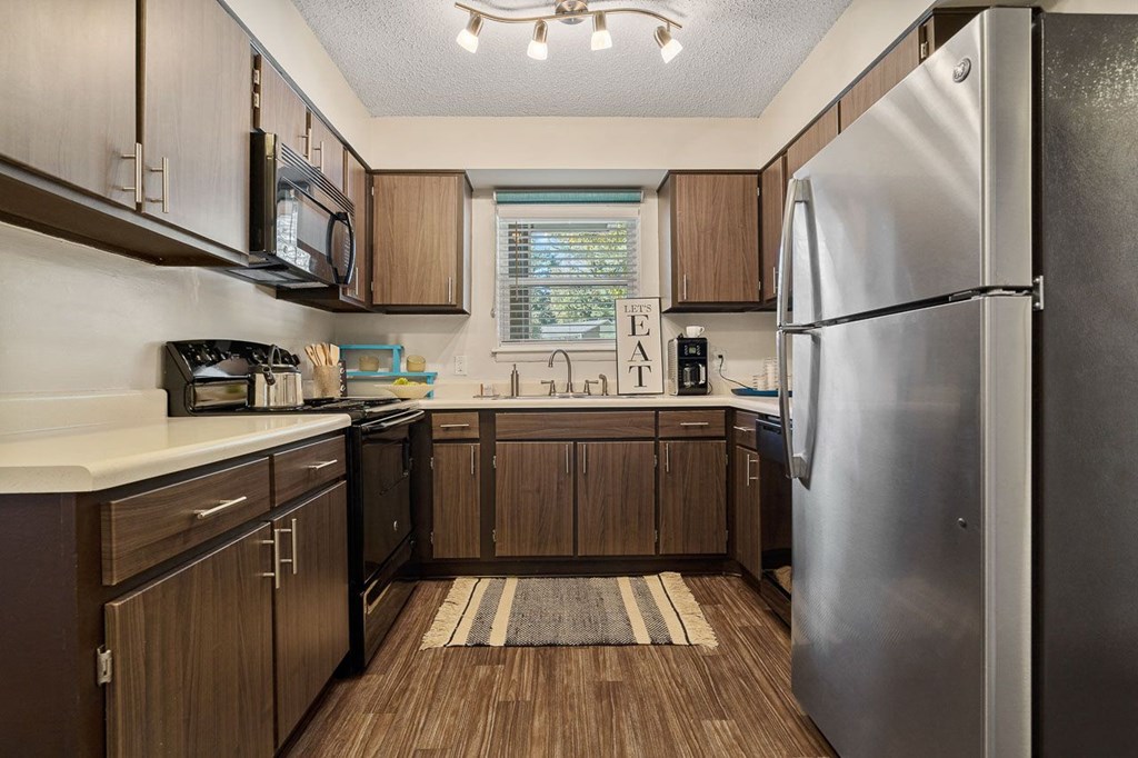 Home Interior Highlight Renovated Cabinets with Stainless Steel Appliances