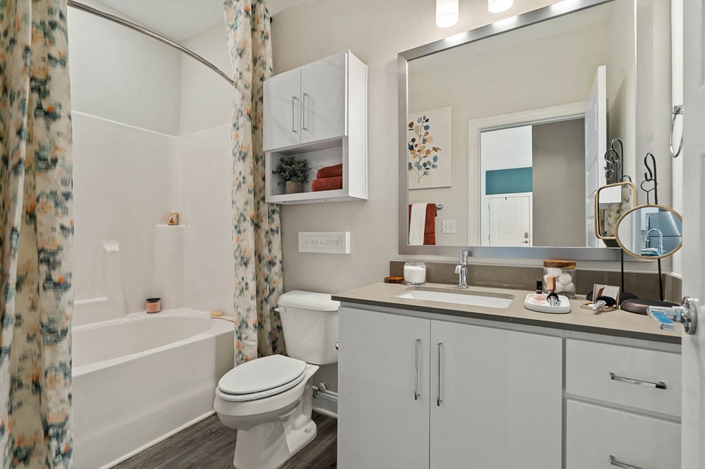 Bathroom with Large Vanity with White Cabinets and Grey Countertops