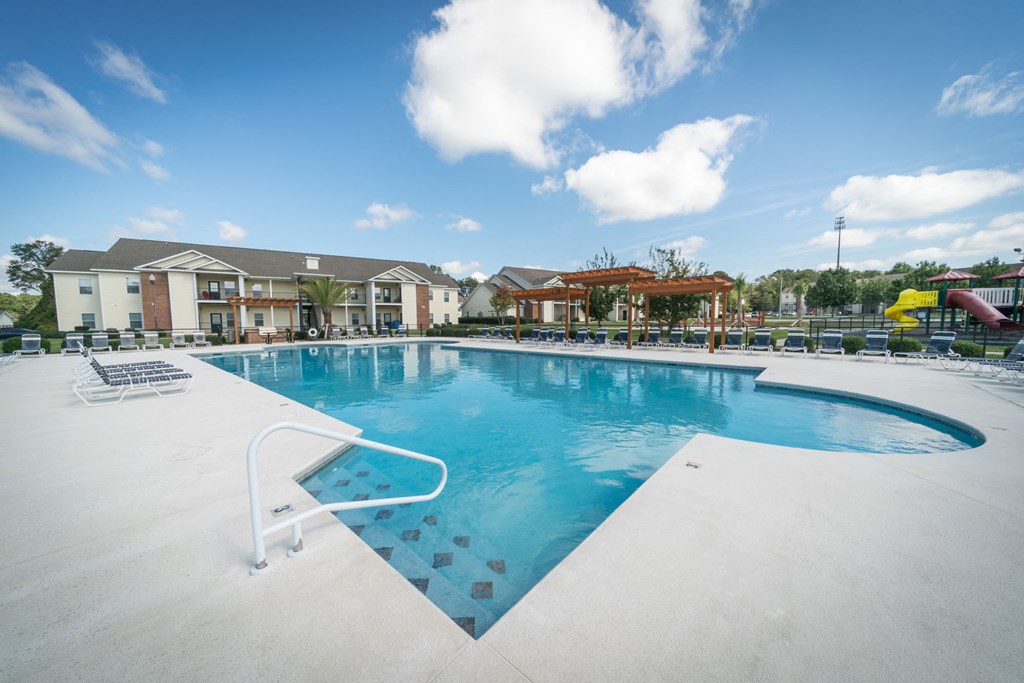 a swimming pool at night with lights above it