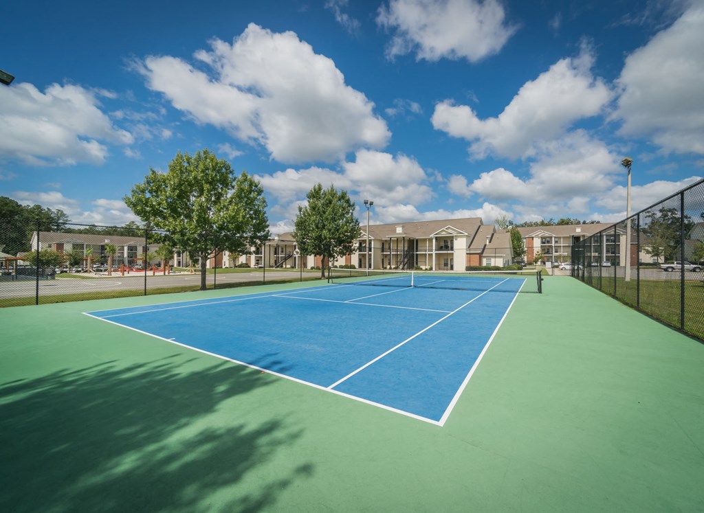 a row of tanks on a hill under a cloudy sky