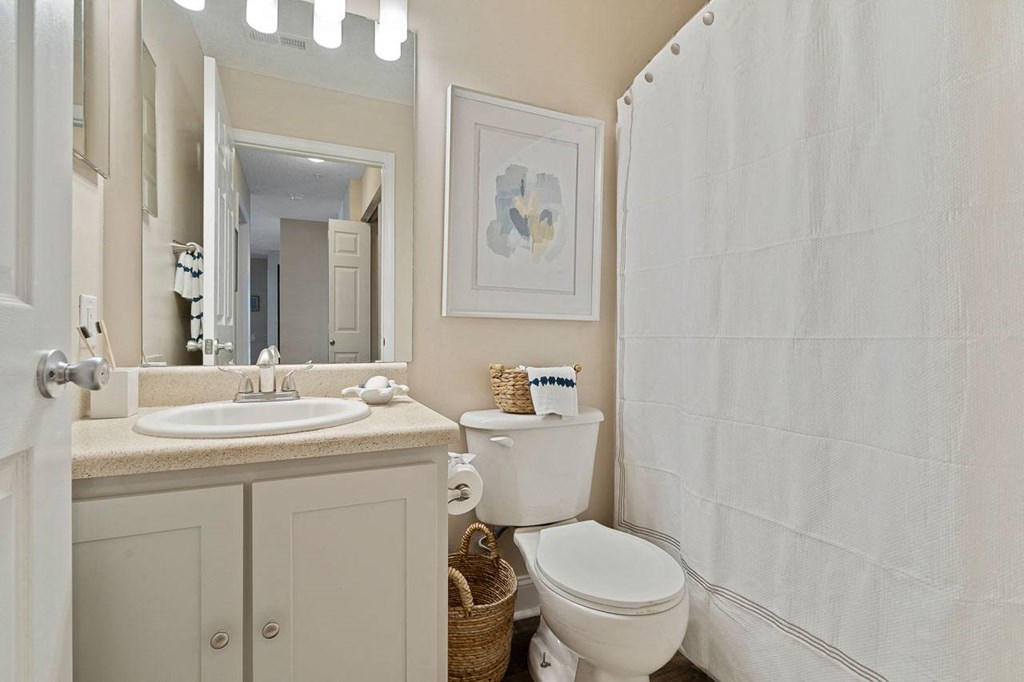 a bathroom with a sink toilet and a shower