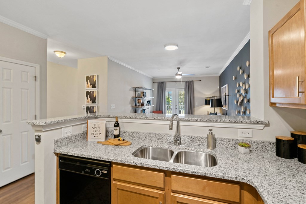 a kitchen with granite counter tops and a sink