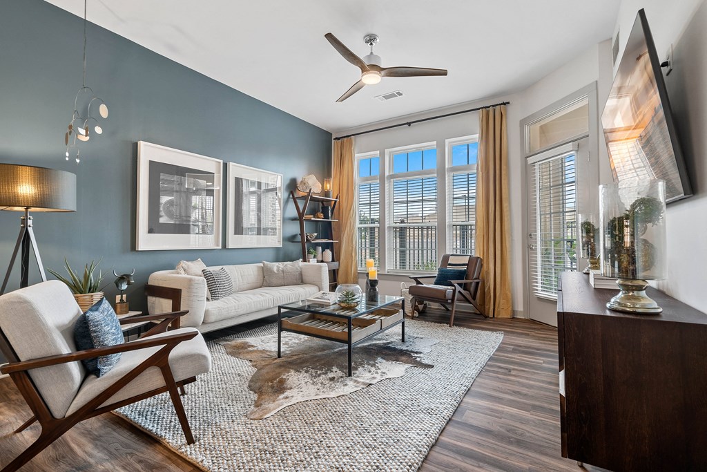 a living room with blue walls and a couch and a coffee table
